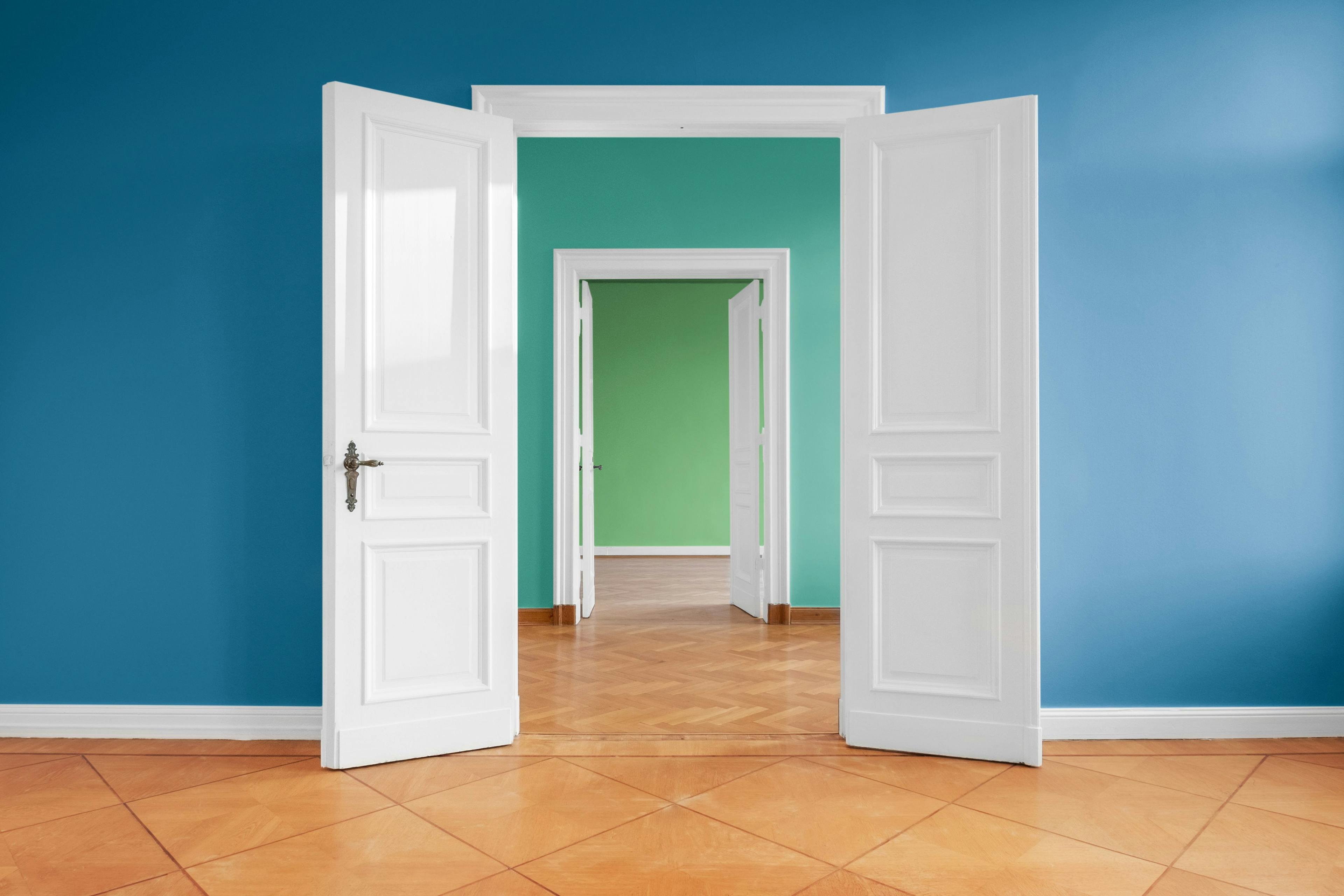image of a white door leading into other open spaces to show that they are accessible